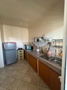 Η κουζίνα ή μικρή κουζίνα στο Residence afoulki 2 hay mohammadi +7 φωτογραφίες