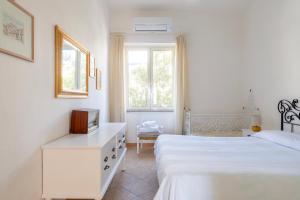 Ένα ή περισσότερα κρεβάτια σε δωμάτιο στο Casa Colombo +12 φωτογραφίες