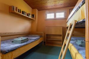 a bedroom with two bunk beds and a window at Villa Armonia Acero in Cerete