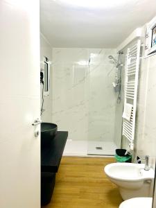 a bathroom with a shower and a toilet and a sink at Savona Sea in Bari