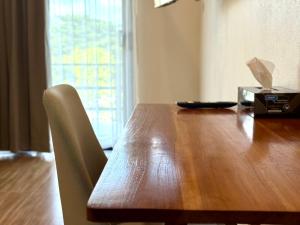 a wooden table with a napkin on top of it at Sman Resort in Lamai