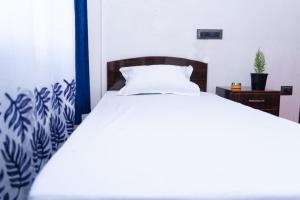 Postel nebo postele na pokoji v ubytování Basosthaan homestay