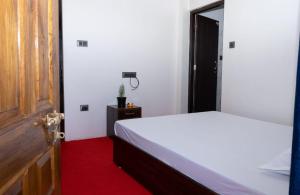 Postel nebo postele na pokoji v ubytování Basosthaan homestay