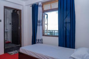 Postel nebo postele na pokoji v ubytování Basosthaan homestay