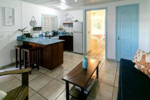 a kitchen and living room with a couch and a table at Candyland Vacation Rentals in Bocas del Toro +15 photos