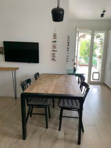 TV a/nebo společenská místnost v ubytování Maison Thiago