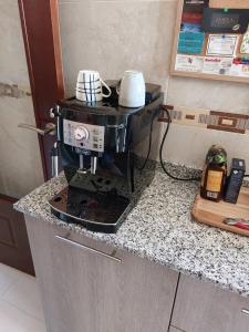 a coffee maker on a counter in a kitchen at Family Townhouse 6 sleeps Maribel in Ciudad Quesada