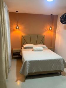 Postel nebo postele na pokoji v ubytování Hotel Lesus