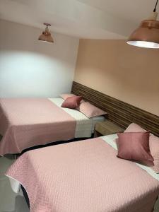 Postel nebo postele na pokoji v ubytování Hotel Lesus