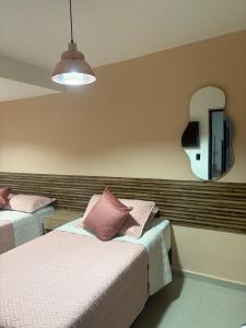 Postel nebo postele na pokoji v ubytování Hotel Lesus