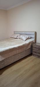 Postel nebo postele na pokoji v ubytování Valodia Guest House In Mestia