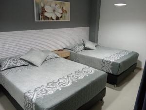 Postel nebo postele na pokoji v ubytování Hotel Lesus