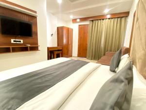 Postelja oz. postelje v sobi nastanitve Sonu Guesthouse & Hostel, Rishikesh