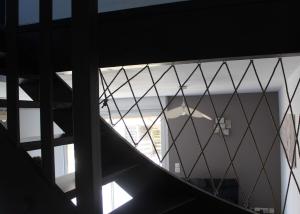 a view from the top of a stairway with a window at Le Cosy Julian in Roye