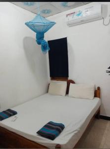 Ένα ή περισσότερα κρεβάτια σε δωμάτιο στο Ashok Guest house