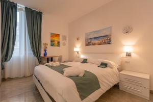 Кровать или кровати в номере Urban Beach Sirena