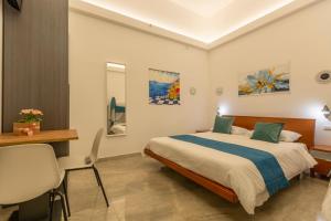 Кровать или кровати в номере Urban Beach Sirena