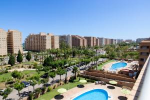 arial view of a city with a pool and buildings at Costa Caribe II vista al mar in El Borseral