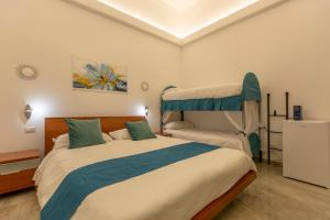 Кровать или кровати в номере Urban Beach Sirena
