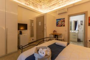 Кровать или кровати в номере Urban Beach Sirena