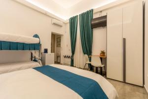 Кровать или кровати в номере Urban Beach Sirena