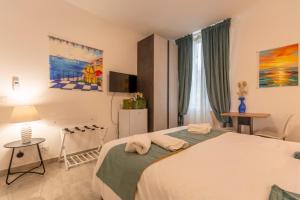 Кровать или кровати в номере Urban Beach Sirena