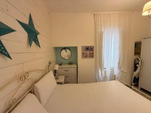 a bedroom with a bed and stars on the wall at Casetta Azzurra in Monopoli