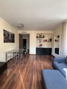 a living room with a table and a couch at La casa di Eli in Genoa