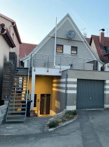 a house with a staircase on the side of it at Zentrales Flair 1 in Bad Staffelstein