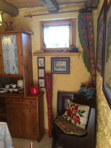 a small room with a chair and a window at La Casetta sulla Marteniga in Trichiana