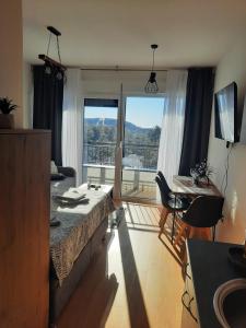 تلفاز و/أو أجهزة ترفيهية في Apartman Pogled Divcibare