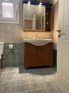 a bathroom with a sink and a mirror at House Garden in Kalamoti in Kalamoti +58 photos