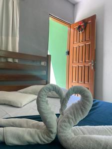 Cama ou camas em um quarto em Pousada Recanto das Tartarugas