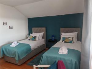 two beds sitting next to each other in a room at Apartman Kristian Zagreb Airport in Velika Gorica