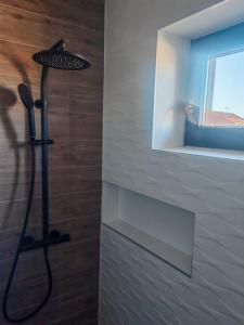 a black floor lamp in a bathroom next to a window at Apartman Kristian Zagreb Airport in Velika Gorica +51 photos