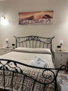 Postel nebo postele na pokoji v ubytování B&B La Dimora Di Nettuno