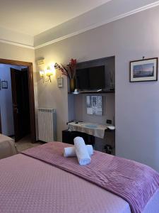 Postel nebo postele na pokoji v ubytování B&B La Dimora Di Nettuno