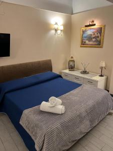 Postel nebo postele na pokoji v ubytování B&B La Dimora Di Nettuno