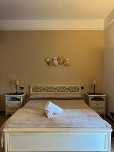 Postel nebo postele na pokoji v ubytování B&B La Dimora Di Nettuno