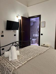 Postel nebo postele na pokoji v ubytování B&B La Dimora Di Nettuno