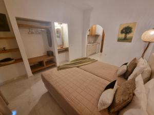 A bed or beds in a room at Olive Grove View