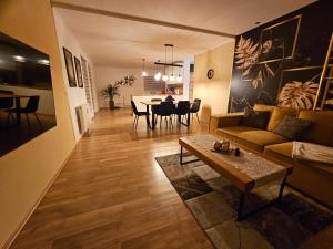 a living room with a couch and a table at Ferienwohnung Blick ins Grüne in Rossleithen