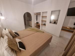 A bed or beds in a room at Olive Grove View
