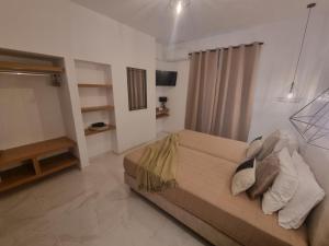 A bed or beds in a room at Olive Grove View