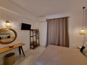 A bed or beds in a room at Olive Grove View