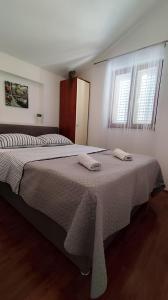 Postel nebo postele na pokoji v ubytování Apartman Beus