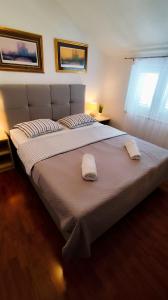Postel nebo postele na pokoji v ubytování Apartman Beus