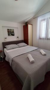 Postel nebo postele na pokoji v ubytování Apartman Beus