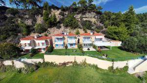 an aerial view of a large house on a hill at Villa Horizontes 1 in Possidi