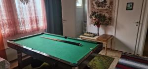 a pool table in a room with chopsticks on it at Apartment Sorsakoski in Sorsakoski